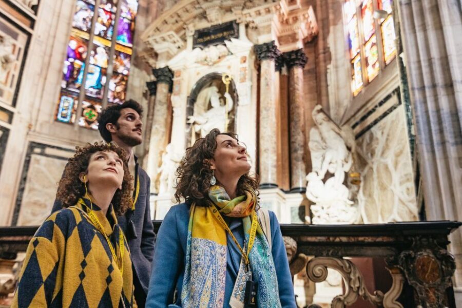 Milan: Duomo Rooftop and Cathedral Guided Tour with Tickets - Rooftop terrace walk: spires, gargoyles, and the 80-steps reality