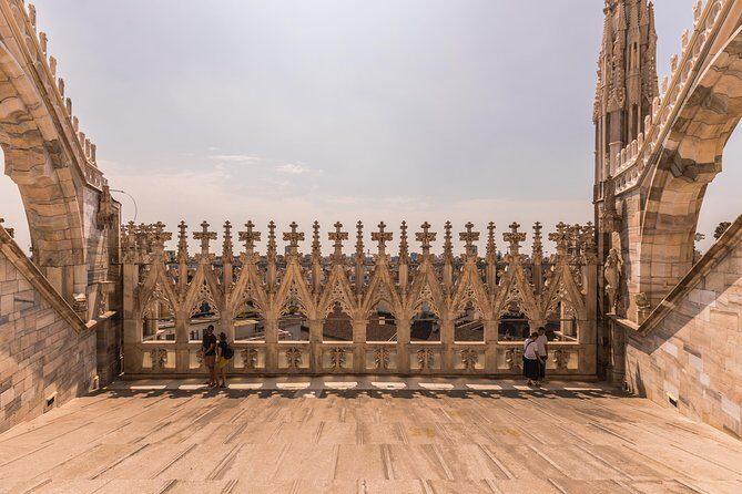 Milan Duomo Rooftop Terrace Guided Tour - Piazza del Duomo Details: Why the Façade Looks Different Up Close