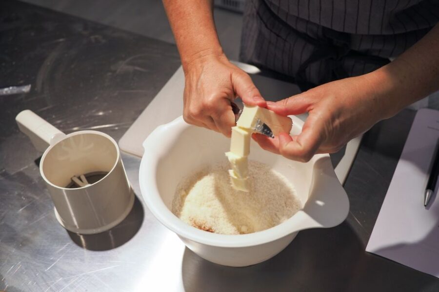 Milan: Italian Cooking Class with Food and Wine - Entering Chef and the City: easy to spot, street-level, hands-on